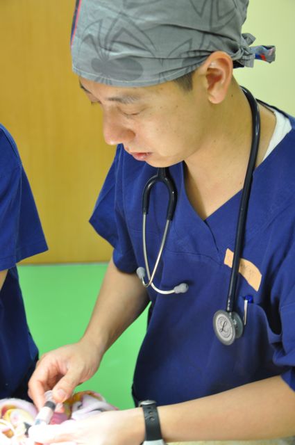 applying the anaesthetic to the smallest patient in Tonga