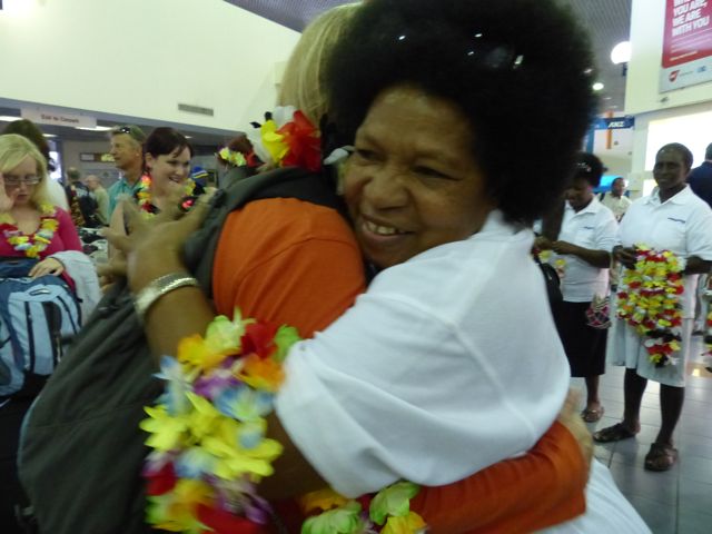 greeting the main team at the airport