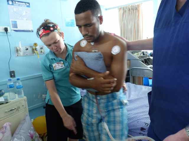 Rosie helping a patient walk 1 day after surgery